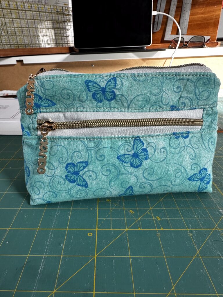 small bag with zipper closer and front zipper pocket